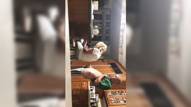 Son jerks off behind mom's back and cums